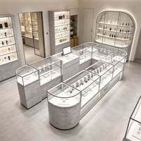 Solution de design de boutique de parfums tout-en-un : comptoir d'exposition de parfums en verre acrylique incurvé, vitrine personnalisée, aménagement intérieur de magasin