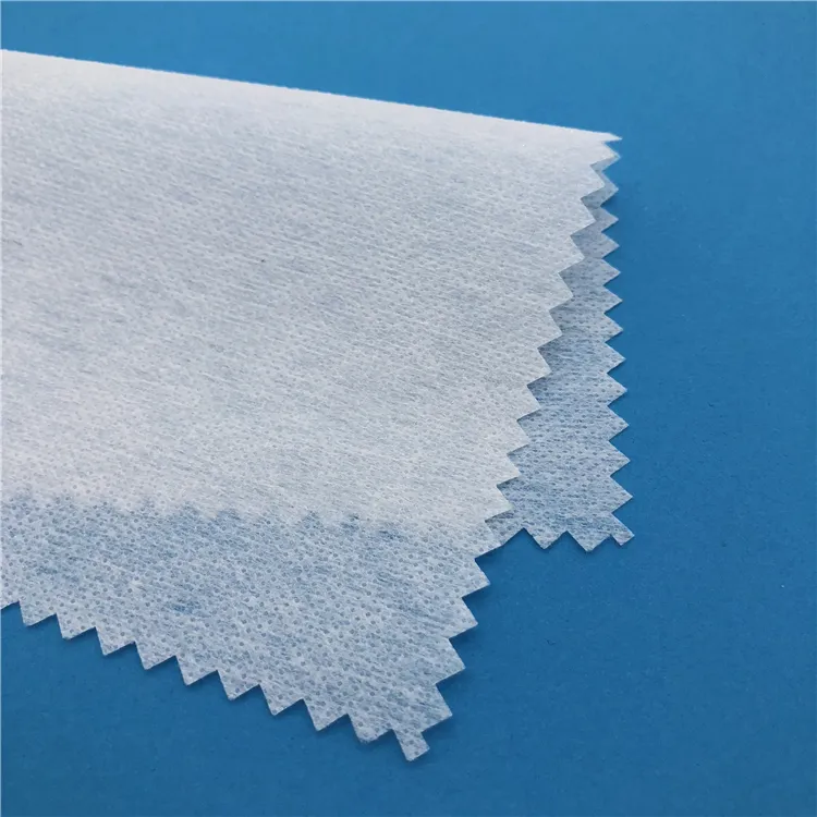 Fusible चिपकने वाला पॉलिएस्टर fusible interlining परिधान nonwoven fusing interfacing कपड़े लोहे पर