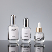 Flacon compte-gouttes ovale en verre transparent avec bouchon compte-gouttes métallique pour emballage de sérum essentiel pour le visage et cosmétiques de marque