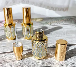 Factory Price Luxury 6ml Refillable Custom Oriental Design Metal UV Glod Alloy Arabic Oil Perfume Bottle