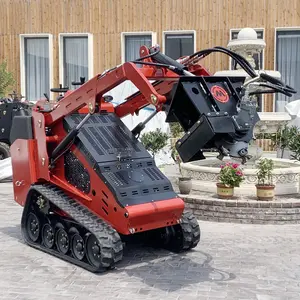 35 HP diesel power stand on operating mini skid steer loader with stump grinder attachments