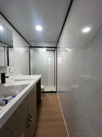 Maison conteneur de luxe extensible de 30 pieds à toit plat, design asiatique, avec salle de bain et chambre, préfabriquée pour usage hôtelier, garantie 3 ans