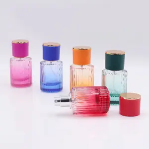 Usine en gros personnalisé rayé rond en forme de cylindre 30ml 50ml coloré vaporisateur atomiseur parfum parfum bouteille en verre