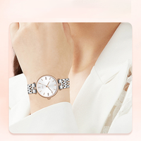 Montre à quartz pour femme, personnalisée, de luxe, décontractée, moderne, bicolore, avec aiguilles en verre, diamants et aiguilles dorées, en acier inoxydable