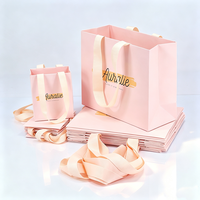 Fournisseur de sacs en papier pliables de luxe personnalisés avec poignées en ruban, pour la promotion de la mode, les cadeaux, les cosmétiques et les parfums, couleur rose