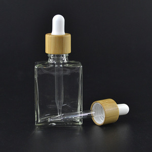 2023 botellas de vidrio de aceite esencial de vidrio, cuadradas, planas, con tapa de gotero de bambú de 30ml - Product Image 3
