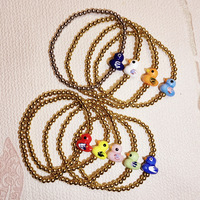 Bracelet extensible en acier inoxydable inaltérable avec perles dorées, motif animal mignon et perles en céramique colorées en forme de petit canard, pour filles