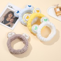 Serre-tête élastique en flanelle OEM en gros, motif grenouille aux grands yeux, pour spa, soins de la peau, maquillage, lavage du visage, cadeau amusant pour fille