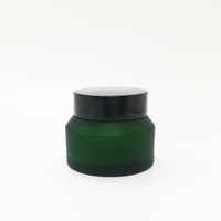 ODM 15ml 30ml 50ml 100ml Pot en verre vide de couleur verte Pot en verre de crème cosmétique Pot en verre d'épaule en pente Pot avec couvercle à vis Fabrication