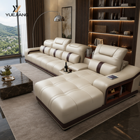 Canapé sectionnel électrique en cuir beige avec appuie-tête réglable et console, personnalisable OEM pour concessionnaires, vente en gros directe d'usine