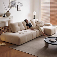 Canapé d'angle en L moderne et luxueux avec assise large et dossier réglable, en tissu, design actuel pour villa et maison