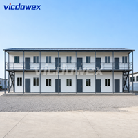 VICDOWEX Maison préfabriquée moderne de type T, construction en acier à panneaux sandwich, isolation thermique, caractéristiques ignifuges, 15-25 ans