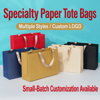 Sac fourre-tout en papier écologique de spécialité avec poignée en ruban satiné, logo personnalisé, styles variés, personnalisation en petites séries, artisanat de luxe