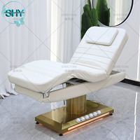Table de massage de luxe à base dorée, lit pour les cils, salon de beauté, mobilier d'esthéticienne, lit facial incurvé, lit électrique pour les cils, lit cosmétique