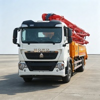 Camion pompe à béton HOWO TX 6X4 d'occasion, 10 pneus, flèche hydraulique en excellent état pour travaux de coulage quotidiens sur chantier