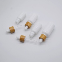Flacon compte-gouttes en verre blanc de 30 ml pour sérum et nettoyant visage avec bouchon en bambou sérigraphié pour usage cosmétique