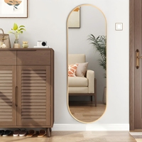 Miroir mural ovale avec cadre en aluminium doré opulent ornement de salon maison réflexion complète du corps pour un habillage gracieux et élégant.
