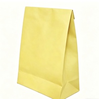 Sacs en papier kraft jaune personnalisables avec design à enroulement, poignées découpées et fond renforcé pour l'emballage alimentaire