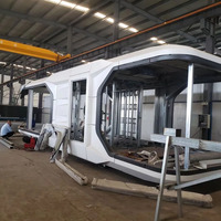Maison capsule spatiale préfabriquée de 20 et 40 pieds, maison conteneur portable personnalisée pour usage scolaire et sportif, alimentée à l'énergie solaire, écologique