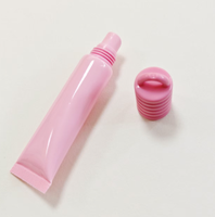 Tubes de gloss à lèvres en PETG avec logo personnalisé, vente en gros, contenants cosmétiques vides à tête ronde, tubes d'emballage pour gloss à lèvres