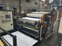 Machine de laminage par application de colle thermofusible pour étiquettes autocollantes, machine d'application de colle thermofusible pour étiquettes de marque en papier