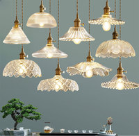 Estilo nórdico moderno minimalista latón colgante luz creativa hoja de loto cristal LED cabecera cobre Villa hogar Oficina