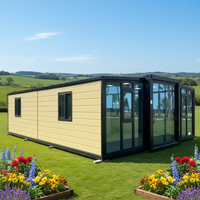 Maison conteneur modulaire préfabriquée en acier de 30 pieds avec façade en verre étanche, conception extensible à double aile pour habitation Ray-Zen