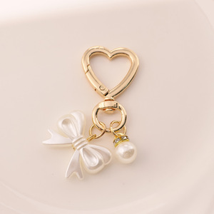 AM Fris en zoet strikje parel gouden deurknop sleutelhanger hanger schattig hoofdtelefoon etui tas hangend ornament - Product Image 3