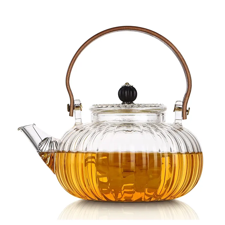 Amazon top sellers 950ml clear tea cup pot set high borosilicate teapot glass tea pot with infuser handle suitable for stovetop