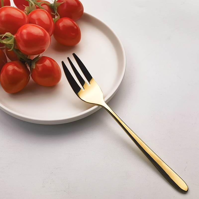 Fourchette principale dorée à manche rond