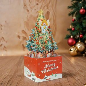 Nouvelle <span class=keywords><strong>carte</strong></span> de vœux 3D créative en boîte avec nœud rouge, arbre de Noël, ange, étoiles dorées - Matériel papier - Product Image 2