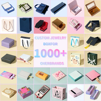 Une boîte d'emballage de bijoux portable avec un vert foncé classique associé à une boîte inférieure beige. Collier Boucles d'oreilles Bague Coffret cadeau