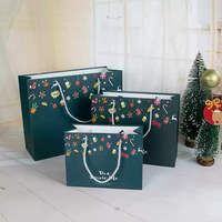 Sac de shopping en papier vert foncé personnalisé avec poignée en corde et impression de Noël pour la vente au détail pendant les fêtes