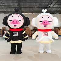 Costume de mascotte cochon noir et blanc gonflable personnalisé pour événements publicitaires, avec ventilateur intégré