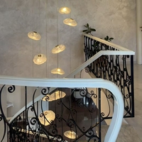 Lustre suspendu moderne personnalisé en verre ovale avec hauteur réglable, idéal pour les halls d'hôtel et les villas