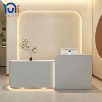 Comptoir de réception minimaliste blanc incurvé, comptoir de réception pour salon de beauté avec éclairage LED, comptoir de réception moderne