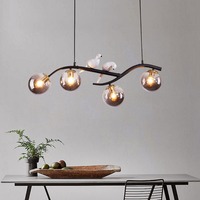 Lampe LED de luxe moderne Ampoule en verre pour oiseau Lampes suspendues Lustres de restaurant à longue bande Design créatif