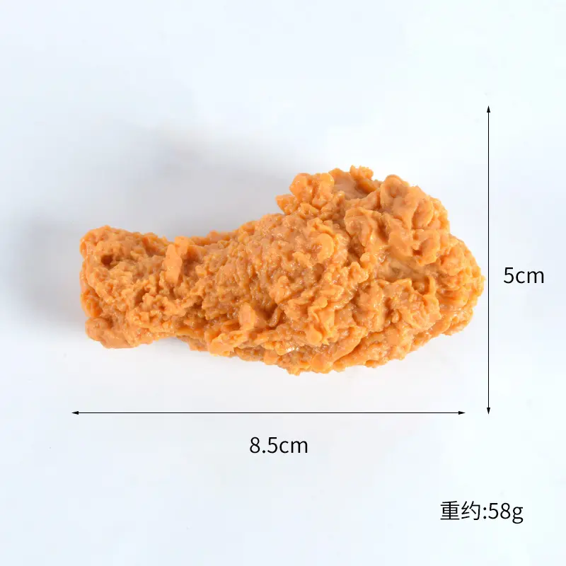 Il display realistico delle ali di pollo del cibo finto simula l'elica del modello di pepita di coscia fritta