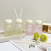 Bouteille en verre vide ronde personnalisée de 100 ml pour diffuseur d'arômes, bouteille de diffuseur d'huiles essentielles