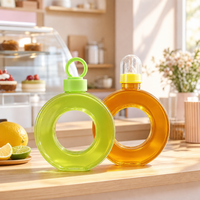 Bouteilles en plastique transparent PETG de 400 ml et 500 ml en forme de donut pour jus, qualité alimentaire, avec anneau et bouchon à poignée portable pour thé au lait Boba – Vente en gros