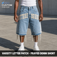 Shorts baggy skater en denim de coton épais 14 oz, avec appliques et ourlet déchiré, pour un style urbain