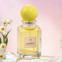 Vente en gros de flacons de parfum en verre cylindriques de 50 ml et 100 ml avec pompe pulvérisatrice et bouchon en forme de boule