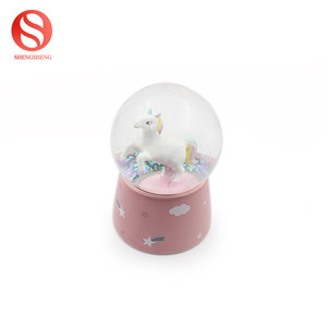 Personnalisé tyrannosaure écologique enfant cadeau LED lumière musique rotation neige céramique dinosaure boule à neige - Product Image 2