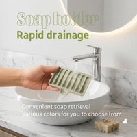 Support moderne en silicone antidérapant et auto-drainant pour savon et éponge de cuisine avec guide d'eau frontal pour évier de salle de bain