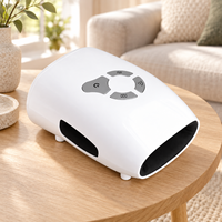 Masseur de main sans fil blanc avec compression d'air, vibration et chaleur pour la relaxation des paumes, rechargeable, arrêt automatique après 10 minutes