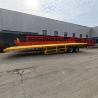Semi-remorque plateau robuste à 2 essieux pour conteneurs multi-tailles 20/40, idéale pour le transport de machines de construction