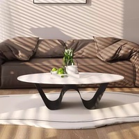 Table basse ovale en ardoise avec structure en fer, design moderne, durable et facile à nettoyer, idéale pour les salons et les petits espaces.