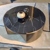 Table basse ronde moderne avec dessus en marbre et base en métal pour salon