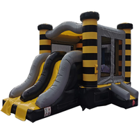 Château gonflable commercial noir et jaune rayé avec double toboggan, idéal pour les entreprises de location