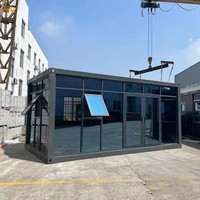 Maison conteneur à mur-rideau en verre haut de gamme, prête à l'installation, construction modulaire en acier pour espace commercial extérieur